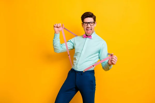 Portrait of funny funky crazy guy pull his suspenders feel candid face expression shouting good look suits isolated over shine color background — Stok Foto