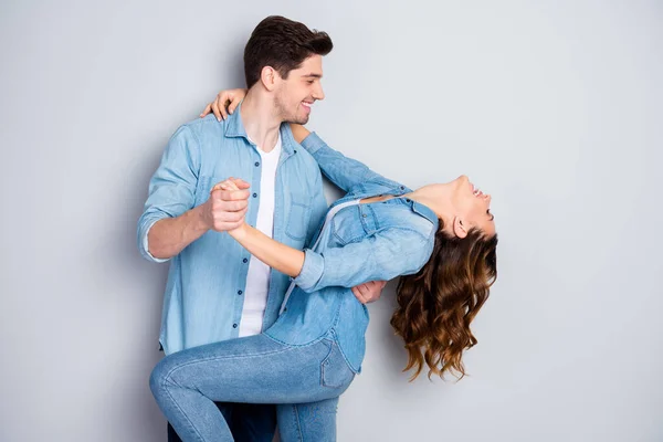 Portrait of positive affectionate tender gentle spouses hug hold hand embrace dance enjoy honeymoon date wear good look clothes isolated over gray color background — Stock Photo, Image