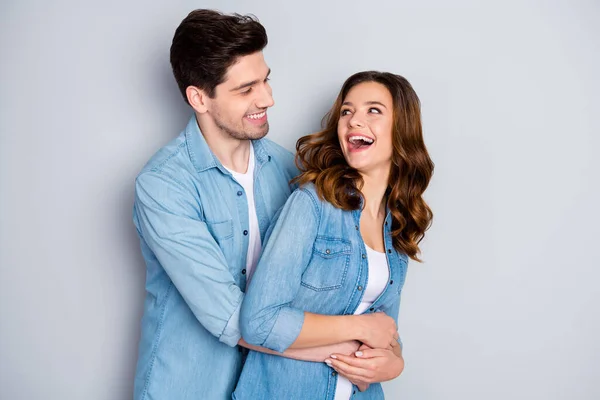 Portrait of cheerful funky student couple embrace cuddle enjoy togetherness wear casual style clothes isolated over gray color background — Stock Photo, Image