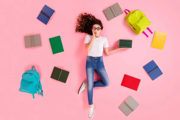 Top view above high angle flat lay flatlay lie concept portrait of nice beautiful smart clever funky small little wavy-haired girl holding in hand many book isolated over pink pastel color background — Stock Photo, Image