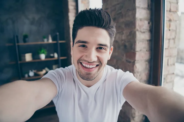 Self-portrait of his he nice attractive cheerful cheery content guy comfort life good morning at modern industrial loft concrete brick interior style living-room indoors