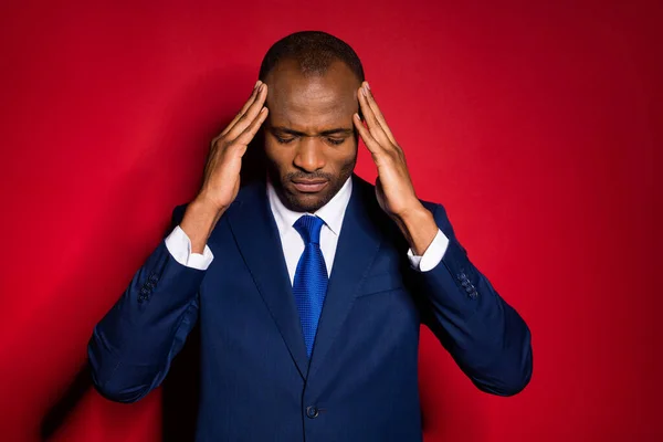 Close-up portrait of his he nice attractive depressed overworked guy employer touching temples feeling bad spasm burn-out isolated over red maroon burgundy marsala color background — Stock Photo, Image