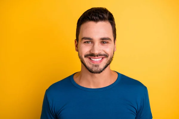 Close-up portrait of his he nice attractive cheerful cheery brunette guy wearing blue tshirt isolated over bright vivid shine vibrant yellow color background — Stock Photo, Image