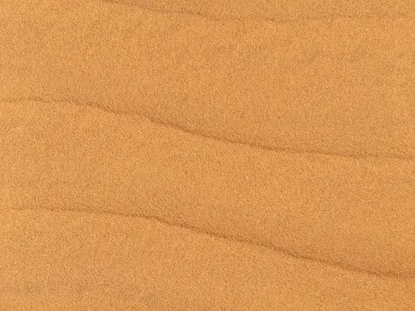 Золотые пески с текстурой на пляже — стоковое фото