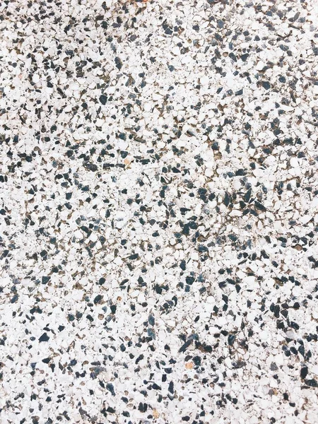 Каменная текстура с черно-белым горшком — стоковое фото
