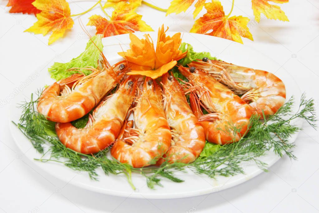 Steamed shrimp with cummin leaves on white dish