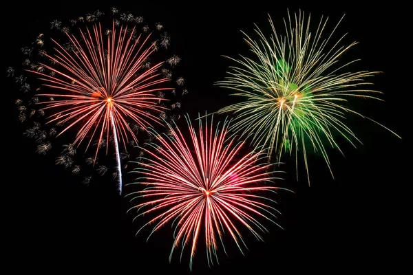 Colorful fireworks of various colors on black background — Stock Photo, Image