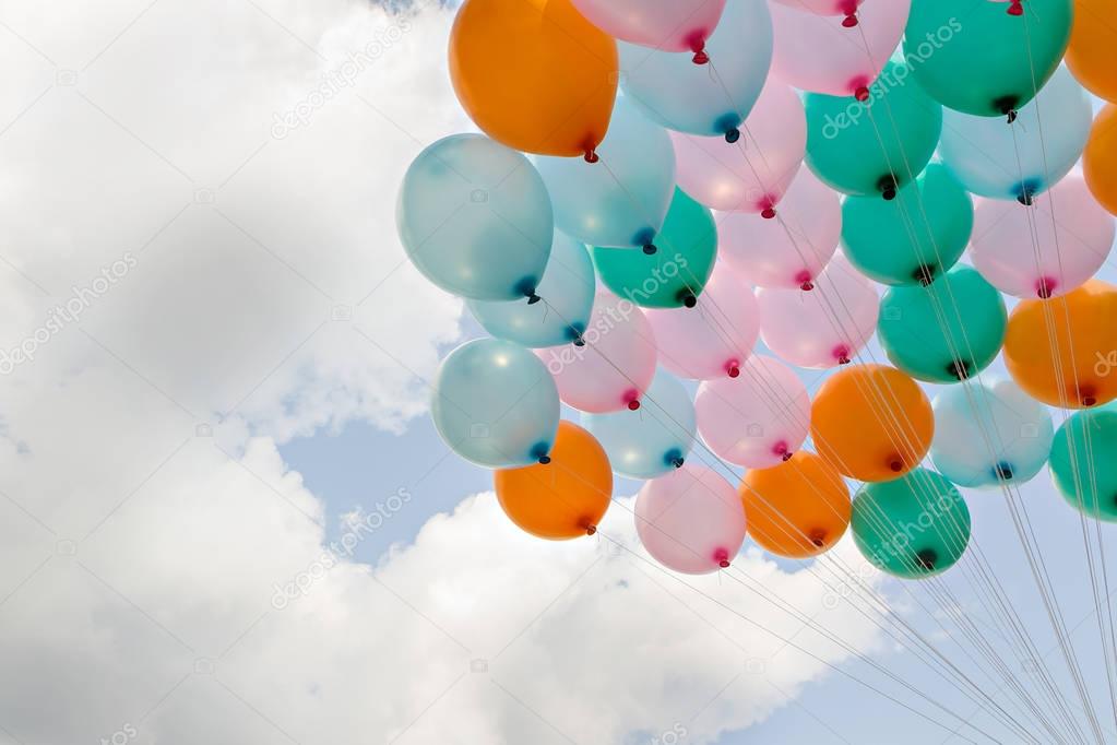 Colorful balloon on blue sky and clouds