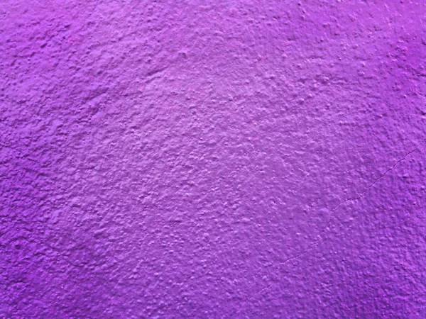 Texture of cracked purple concrete wall for background