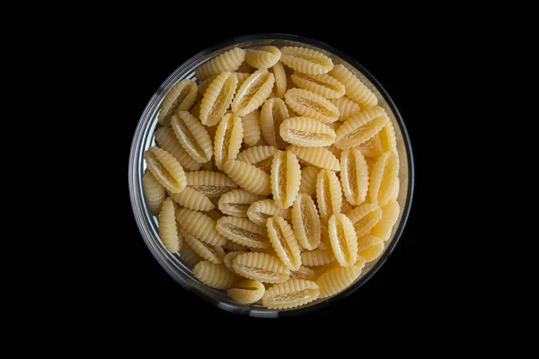 Pasta fundo close-up cru. Delicioso ingrediente seco não cozido para pratos tradicionais da cozinha italiana. Formas de variedade texturizadas. Vista superior. Espaço de cópia — Fotografia de Stock