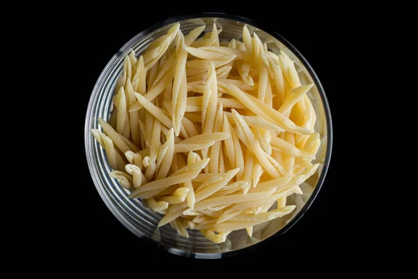 Pasta raw closeup background. Delicious dry uncooked ingredient for traditional Italian cuisine dish. Textured variety shapes. Top view. Copy space — Stock Photo, Image
