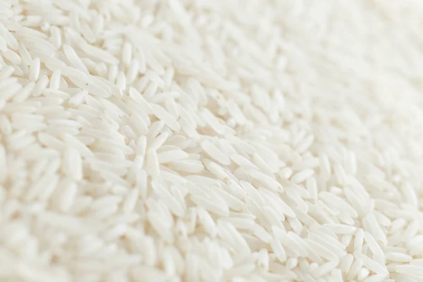 Rice, white grains closeup. Basmati. Unpolished, uncooked, natural, diet, raw for traditional asian cuisine, dish. Popular agriculture cereal, Texture pattern background copy space — Stock Photo, Image