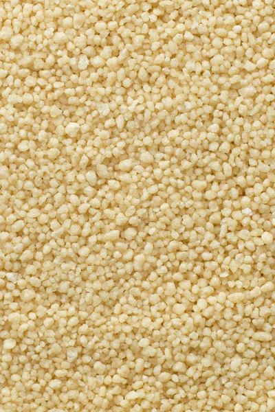 Couscous closeup. Bulgur. Uncooked, natural, diet, raw for traditional Middle East and Mediterranean cuisine, dish. Popular agriculture cereal. Texture pattern background, copy space — Stock Photo, Image