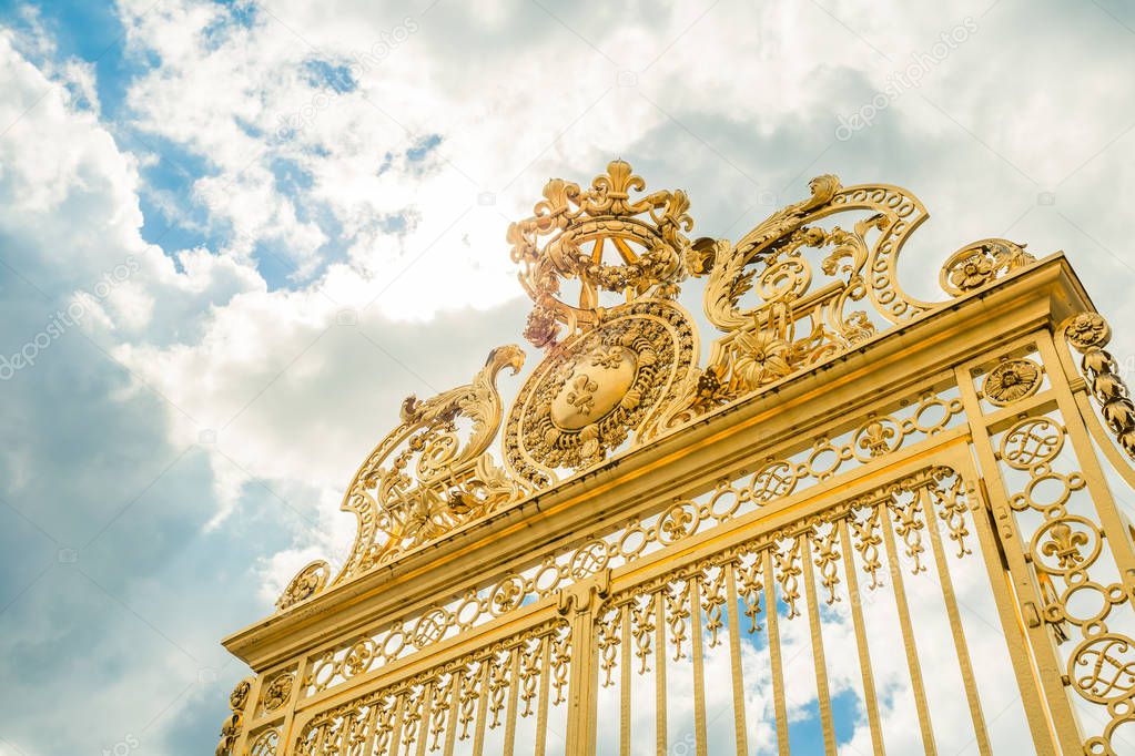 Versailles chateau. France. View of golden gate to palace. Royal