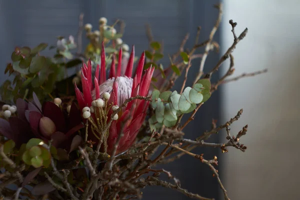 Modern exotic bouquet without packaging, ecological floristry concept, selective focus