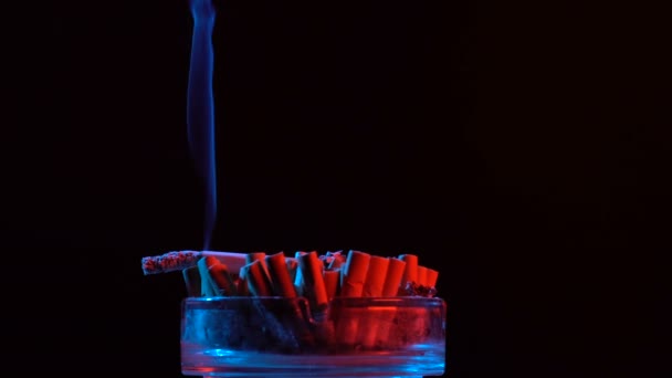 Smoldering cigarette in an ashtray — Stock Video