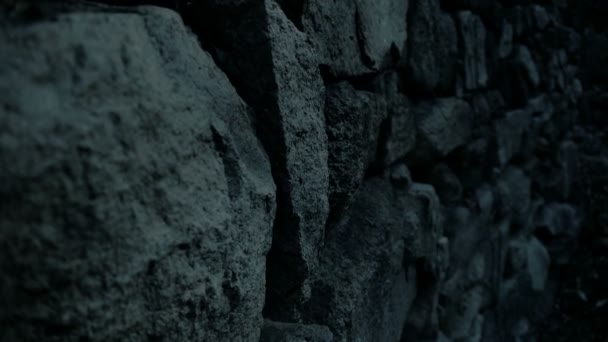 Nostalgic stone wall at night. — Stock Video