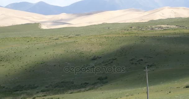 4k far away Desert & grassland scenery,plateau landform,cloud shadow rolling ov — Stock Video