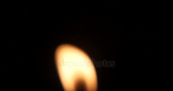 4k Candle fire in wind, close up . — стоковое видео