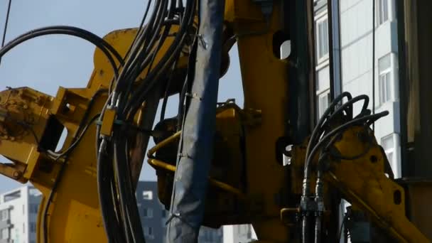 Drilling machinery,Construction of city buildings. — Stock Video