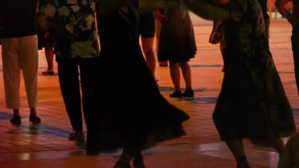 China-Aug 08,2016:Dancing Chinese people crowd in the square at night. — Stock Video