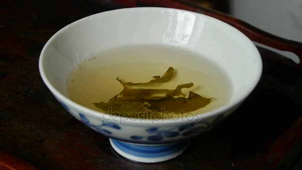 Ένα μπολ με αχνιστό tea.china,japan,water,steaming. — Αρχείο Βίντεο