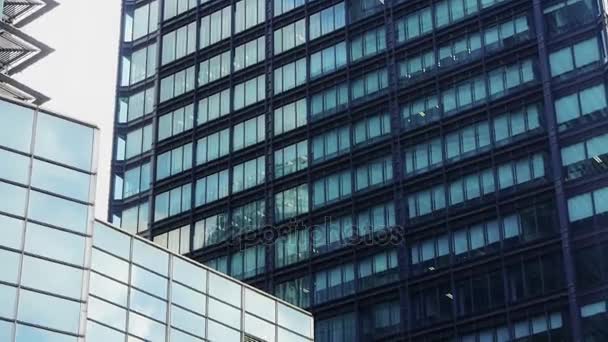 Closeup skyscraper glass windows,urban morden business buildings district. — Stock Video