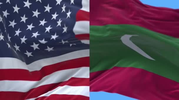 4k Estados Unidos de América Estados Unidos y Maldivas Bandera nacional en el fondo del viento . — Vídeos de Stock