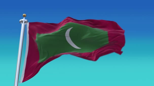 4k Maldive Bandiera nazionale lento rughe senza soluzione di continuità sventolando vento in cielo sfondo . — Video Stock