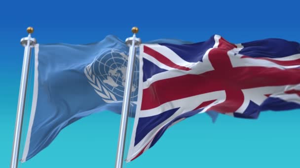 4k ไร้รอยต่อสหประชาชาติและสหราชอาณาจักร ธงอังกฤษที่มีสีฟ้า s — วีดีโอสต็อก