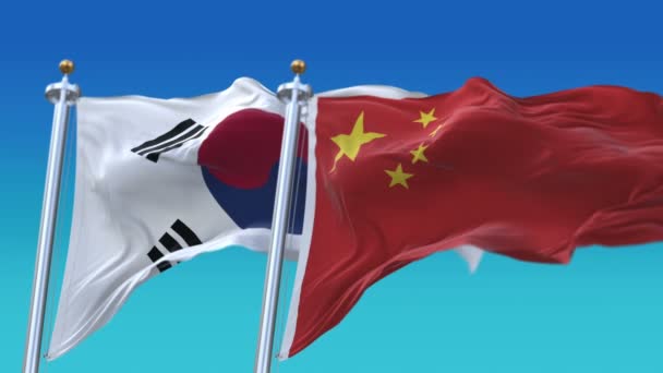 4k naadloze Zuid-Korea en China vlaggen met blauwe hemel achtergrond, rok CHN CN. — Stockvideo