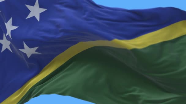 4k所罗门群岛国旗起皱，风天飘扬，背景无缝. — 图库视频影像