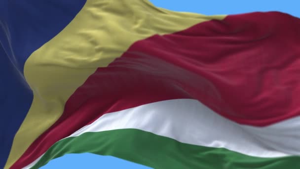 4k Seychelles Bandera nacional arrugas ondeando viento cielo sin costuras lazo fondo . — Vídeo de stock