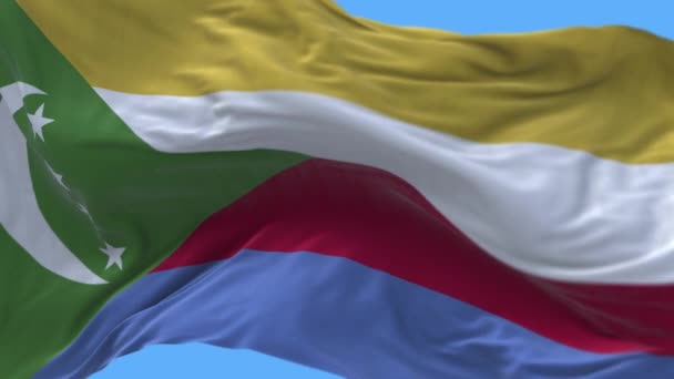 4k Komoren Nationalflagge Falten wehen Wind Himmel nahtlose Schleife Hintergrund. — Stockvideo