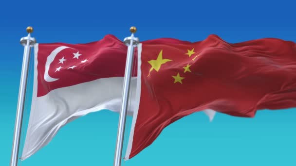 4k nahtlose Singapore und China-Flaggen mit blauem Himmel Hintergrund, sin sg chn cn. — Stockvideo
