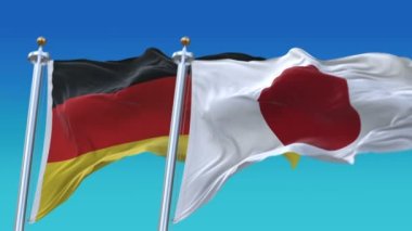 Mavi gökyüzü arka plan ile 4k Dikişsiz Almanya ve Japonya Bayrakları, Ger De Jpn Jp.