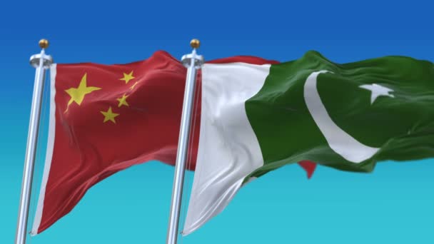 4K bezszwowe Pakistan i Chiny flagi z niebieskim tle nieba, Pak PK CHN CN. — Wideo stockowe