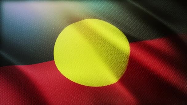 4k Australia ABORIGINES Bandera aborigen ondeando lentamente sin costuras en el fondo del viento — Vídeos de Stock