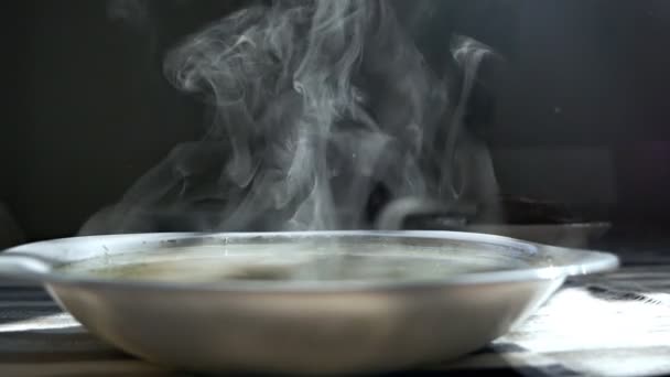 Chicken noodle soup - broth. Traditional chicken soup served in a bowl. Steam from a bowl of soup — Stock Video