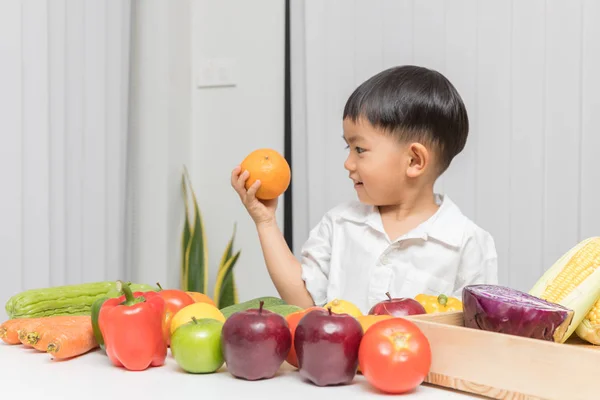 Healthy and nutrition concept. Kid learning about nutrition with doctor to choose eating fresh fruits and vegetables.