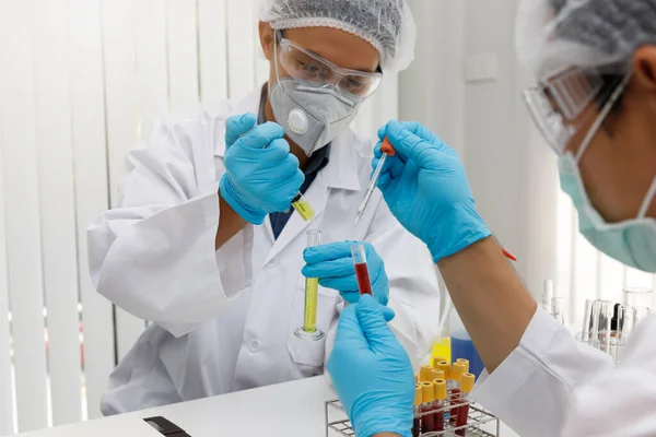 Research and development concept, Laboratory scientist researching covid-19(corona virus) vaccine at laboratory.