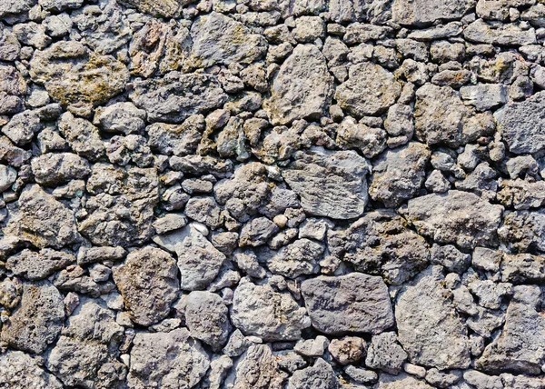 traditional wall of volcanic stones