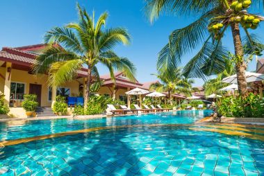 beautiful swimming pool in tropical resort , Phuket, Thailand.  clipart