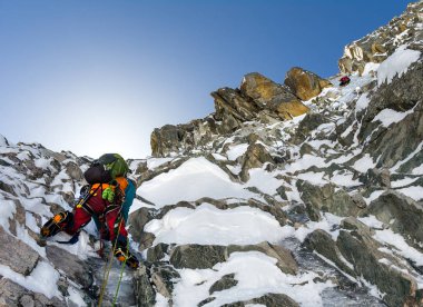 climbers at the mountain summit in scenic Tian Shan range in Kyr clipart