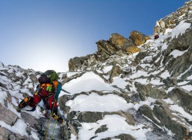 climbers at the mountain summit in scenic Tian Shan range in Kyr clipart