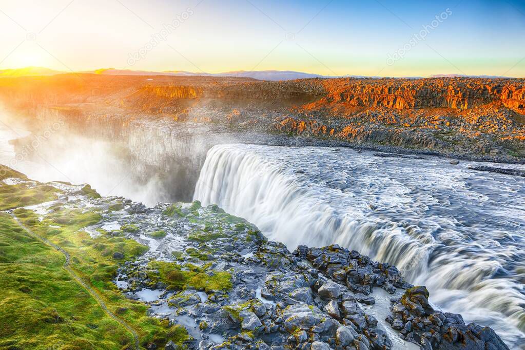 Dramatic sunset view  of the most powerful waterfall in Europe c