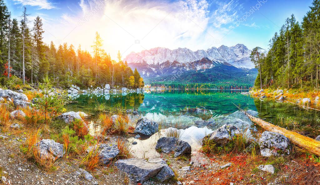 Faboulus autumn landscape of Eibsee Lake in front of Zugspitze s