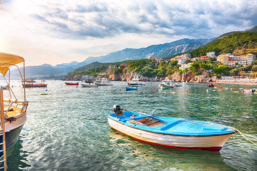 Picturesque summer view of Adriatic sea coast in Budva Riviera near Przno village with lots of boats in the sea. Location: Przno village, Montenegro, Balkans, Europe