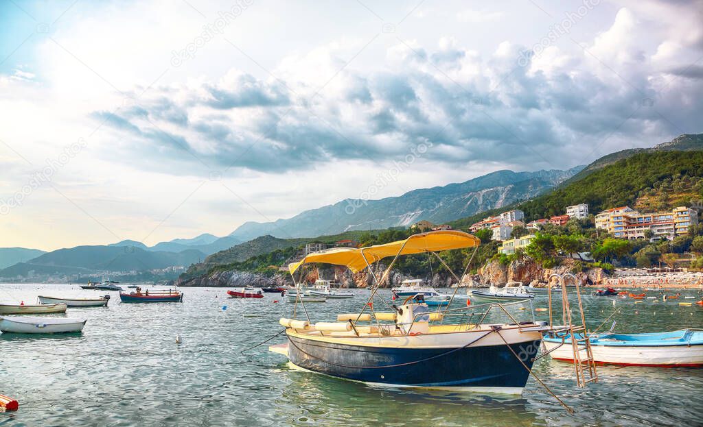 Picturesque summer view of Adriatic sea coast in Budva Riviera near Przno village with lots of boats in the sea. Location: Przno village, Montenegro, Balkans, Europe
