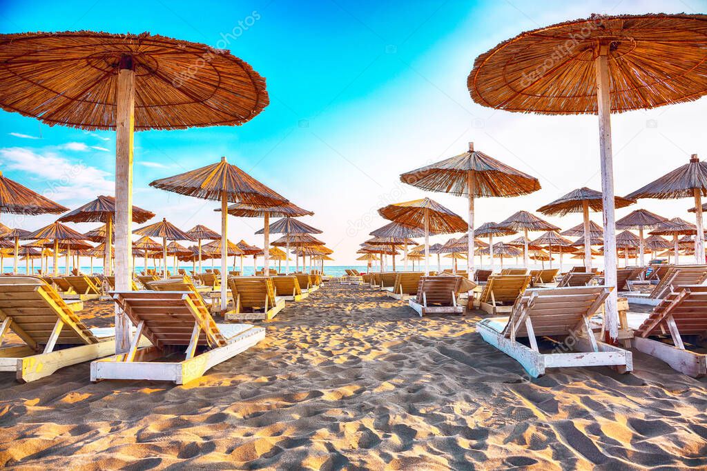 Sun umbrellas and deckchairs on the Copacabana beach, part of Great Beach (Velika Plaza) in Ulcinj. Location: Ulcinj, Montenegro, Balkans, Europe